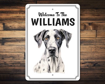 May include: White metal sign with black text that reads "Welcome to the WILLIAMS" and a black and white illustration of a German Shorthaired Pointer dog.