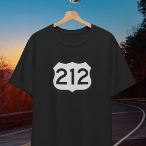 May include: Black t-shirt with a white highway sign featuring the number 212.