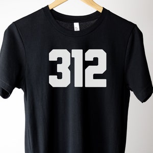 May include: Black t-shirt with white text that says "312" in a large, bold font.