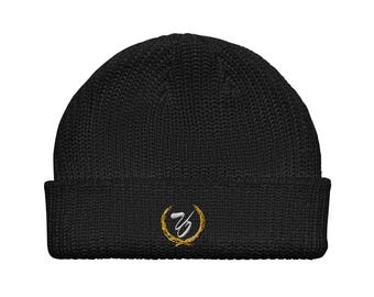 Puede incluir: Gorro de punto negro con un logotipo bordado en oro y blanco del número 70 dentro de una corona.