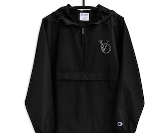 May include: Black Champion windbreaker jacket with a zipper closure and a white embroidered "VO" logo on the front. The jacket has a hood and a kangaroo pocket.