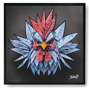 May include: A framed artwork featuring a stylized rooster illustration. The rooster is depicted with a red comb and wattle, blue and white feathers, and an orange beak and eyes. The artwork is set against a dark gray background.