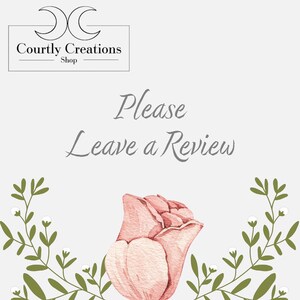 May include: A pink watercolor rose with green leaves and white flowers. The text "Please Leave a Review" is written in gray text. The text "Courtly Creations Shop" is written in black text.