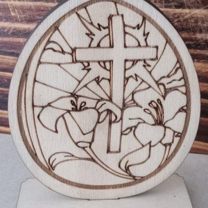 Easter egg with cross and lily flower