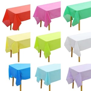 May include: Set of ten plastic tablecloths in various colors, including red, pink, green, yellow, light green, white, light blue, blue, and lavender. The tablecloths are rectangular and have a smooth, glossy finish.