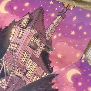 May include: A whimsical illustration of a crooked, multi-story house with a tall chimney, set against a purple night sky with twinkling stars and a crescent moon. The house has multiple windows and a balcony, and is lit with string lights.