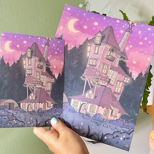 May include: A whimsical illustration of a pink and purple house with a crescent moon and stars in the sky. The house has many windows and is surrounded by trees.