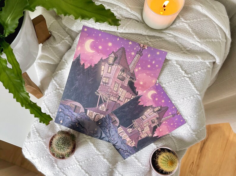 May include: Two illustrations of a whimsical, tilted house with a tower, set against a purple sky with a crescent moon and stars. The house is surrounded by trees and clouds.