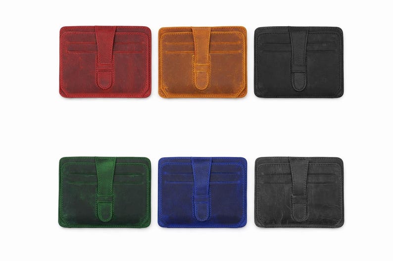 May include: A collection of six leather cardholders in various colors: red, brown, black, green, blue, and gray. Each cardholder features a flap closure with a strap and multiple card slots, ideal for carrying credit cards and IDs.