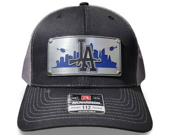 LA Skyline with LA and an Ak47 trucker hat