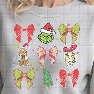 May include: A light grey sweatshirt with a grid pattern of festive Christmas designs. The print includes red and green bows, the Grinch, Max the dog, Cindy Lou Who, and a Christmas tree. The graphics are in a cartoon style.