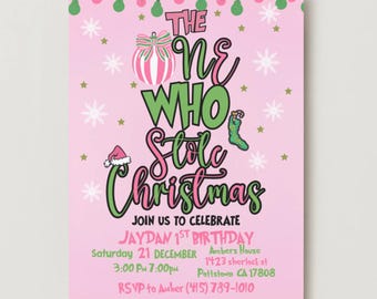 May include: A pink invitation card with the text "THE ONE WHO Stole Christmas" in green and pink. The invitation is for Jaydan's 1st birthday on December 21st. Features festive decorations like snowflakes, stars, and Christmas lights.