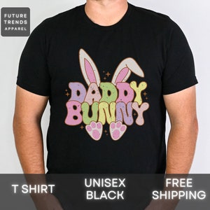 May include: Black t-shirt with a graphic of a colorful bunny with the text "Daddy Bunny".