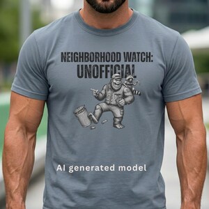 May include: A slate blue crew neck t-shirt featuring a graphic illustration of a bearded character in a cap and vest pointing at a trash can with a raccoon on their shoulder. The text reads NEIGHBORHOOD WATCH: UNOFFICIAL and AI generated model.