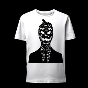 May include: A white t-shirt with a black silhouette of a person wearing a suit and a pumpkin head with a scary face.