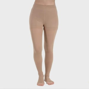 May include: Tan compression stockings with open toes. The stockings are opaque and cover the legs from the toes to the upper thighs. The fabric appears smooth and seamless. The background is a solid, neutral color.