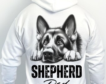 May include: White hoodie with a black and white German Shepherd dog graphic. The dog's head and paws are visible, with the text "SHEPHERD Dad" in black below. The hoodie has a drawstring hood and long sleeves, suitable for cooler weather.