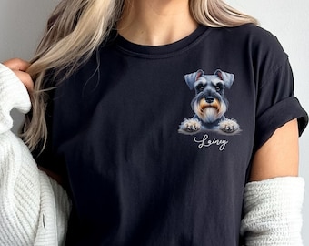 May include: Black t-shirt featuring a Schnauzer dog illustration with the name "Lainey" in cursive script. The dog has gray and black fur with a tan beard. The shirt is a dark navy blue color.