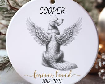 May include: A white ceramic ornament with a gold ribbon for hanging. The ornament features a detailed illustration of a dog with angel wings, the name "COOPER" above, and the text "forever loved" and dates "2013-2025" below.