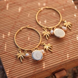 Boucle d'oreille à breloque oeil de ste lucie et palmier