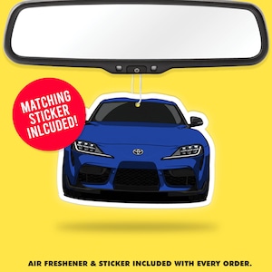 May include: Blue car air freshener with a matching sticker included. The car is a Toyota Supra with a white background.