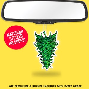 May include: Green marijuana leaf air freshener hanging from a rearview mirror. The air freshener is shaped like a marijuana bud. The text "MATCHING STICKER INLCUDED!" is in a red circle.