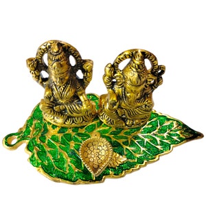 Handcrafted Metal Ganesha and Laxmi Statue for Prosperity and Devotional Home Decor.