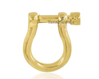May include: A gold-colored, U-shaped earring with a straight bar and screw closure. The earring has a polished finish and the text "Yanshjewels" is visible on the bar.