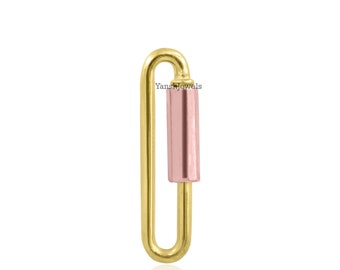 May include: Gold-toned metal clasp with a rose gold-toned cylinder in the center.  YanshJewels is printed on the cylinder.
