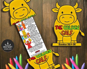 May include: A yellow paper craft featuring a cartoon golden calf with the text "THE GOLDEN CALF" and "Exodus 32:1-35". The craft includes a story strip with illustrations and text. Colorful crayons are arranged around the craft.