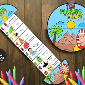 May include: An educational game illustrating the "Ten Plagues of Egypt." The design includes a circular graphic with pyramids and a pharaoh, and a vertical chart detailing the plagues. The game is accompanied by a set of colorful crayons.