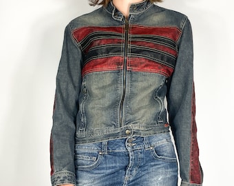 May include: A blue denim jacket with red and black stripes across the chest. The jacket has a zipper closure and a stand-up collar.