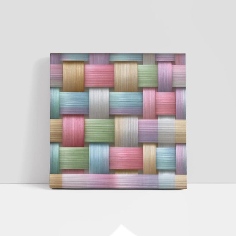 May include: A square canvas print featuring a woven pattern in pastel colors. The design incorporates strips of pink, green, blue, yellow, and white, creating a textured, grid-like appearance. The artwork is displayed against a white background.