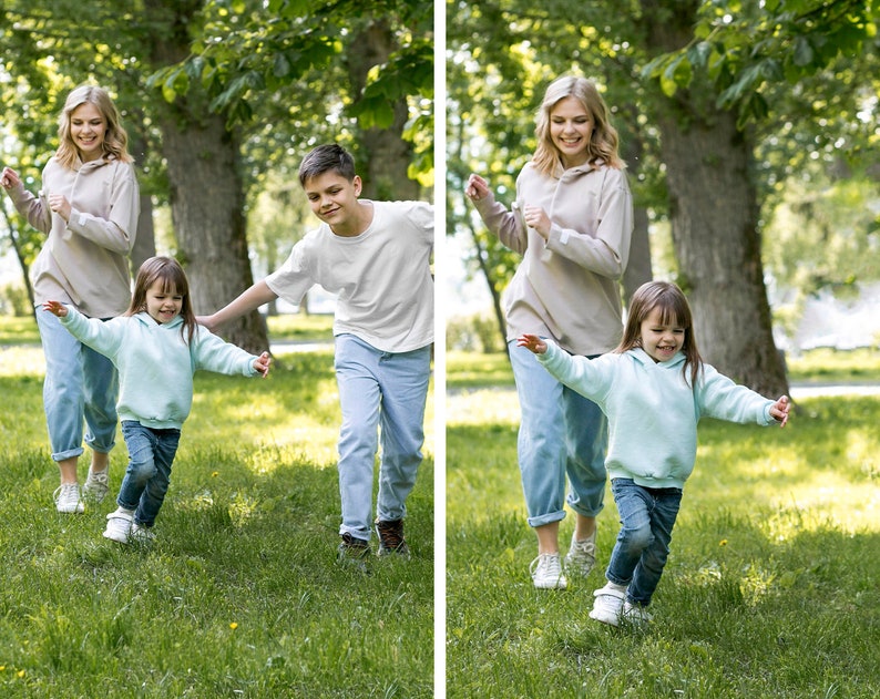 May include: Three people, two adults and a child, are running and laughing in a grassy park. The adults are wearing casual clothing, while the child is wearing a light blue hoodie. The adults are both female and have long, straight hair. The child is female and has short, curly hair.