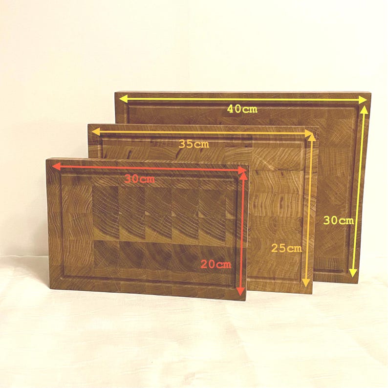 May include: Three wooden cutting boards of varying sizes. The largest board measures 40cm x 30cm (15.7 x 11.8 inches), the medium board is 35cm x 25cm (13.8 x 9.8 inches), and the smallest is 30cm x 20cm (11.8 x 7.9 inches).