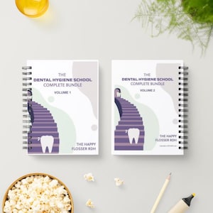 May include: Two spiral-bound notebooks with the text "THE DENTAL HYGIENE SCHOOL COMPLETE BUNDLE" and "VOLUME 1" and "VOLUME 2". The covers feature a purple staircase design and a tooth graphic. The text "THE HAPPY FLOSSER RDH" is also visible.