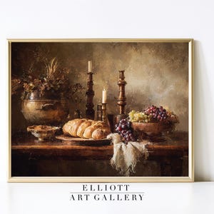 May include: A still life painting featuring a wooden table laden with food and decor. A loaf of bread, grapes, and a bowl of nuts are present. Two candlesticks with lit candles and a copper pot with dried flowers complete the scene. The text "ELLIOTT ART GALLERY" is at the bottom.