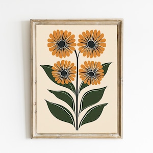 May include: Framed floral art print featuring four stylized orange flowers with black centers and green leaves against a cream background. The artwork is in a wooden frame, suitable for home decor.
