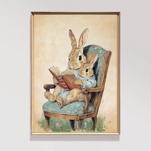 May include: Two brown rabbits sitting in a blue and brown armchair, reading a book together. The larger rabbit is holding the book open and the smaller rabbit is looking at the book. The background is a light beige.