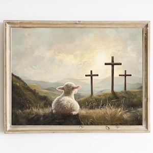 May include: A framed painting of a white lamb sitting on a grassy hill, looking up at three wooden crosses silhouetted against a cloudy sky.