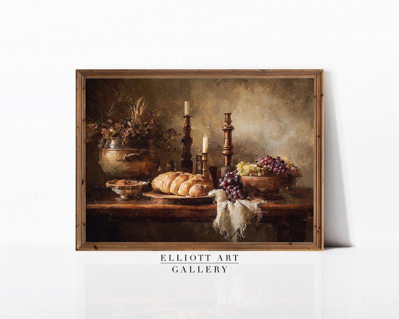 May include: A framed still life painting featuring a rustic table setting. The scene includes a loaf of bread, grapes, candles, and a decorative bowl. The color palette is dominated by warm browns and golds, creating a vintage aesthetic. The text "ELLIOTT ART GALLERY" is at the bottom.