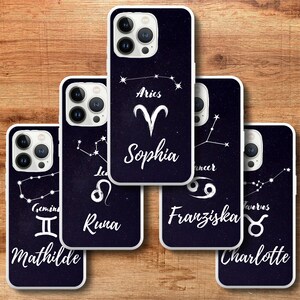 May include: Five different phone cases with a black background and white zodiac signs and names. The cases feature the zodiac signs for Aries, Gemini, Leo, Cancer, and Taurus. The names on the cases are Sophia, Mathilde, Runa, Franziska, and Charlotte.