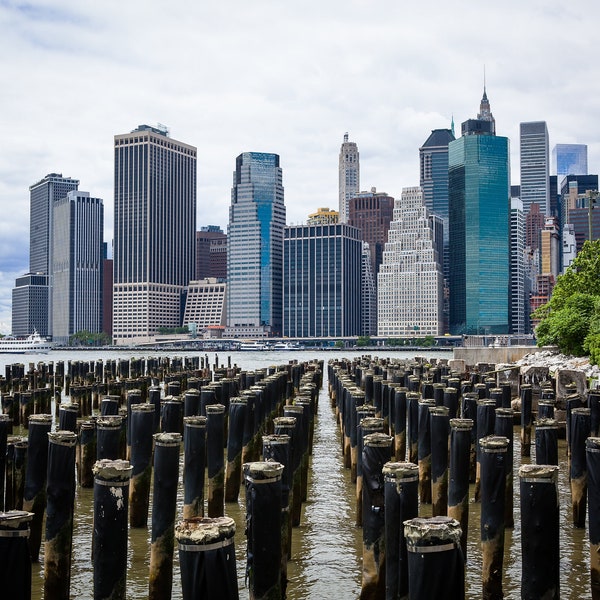 Downtown Manhattan Skyline from Brooklyn with pier pylons in foreground-Color