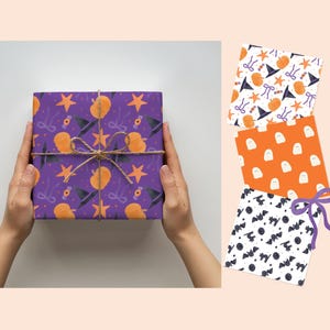May include: A square gift box wrapped in purple paper featuring a pattern of orange pumpkins, black witch hats, orange stars, and purple bows, tied with twine. Three additional sheets of wrapping paper show ghost, bat, and witch hat patterns.