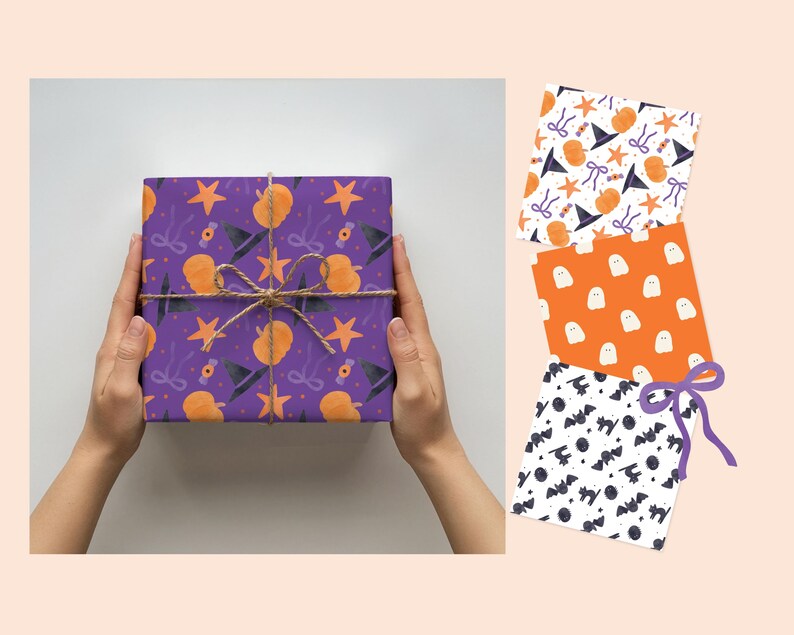 May include: A square gift box wrapped in purple paper featuring a pattern of orange pumpkins, black witch hats, orange stars, and purple bows, tied with twine. Three additional sheets of wrapping paper show ghost, bat, and witch hat patterns.
