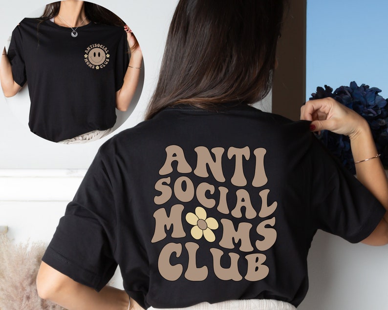 May include: Black t-shirt with a brown graphic on the back that says "Anti Social Moms Club" with a yellow flower in the middle of the word "Moms".