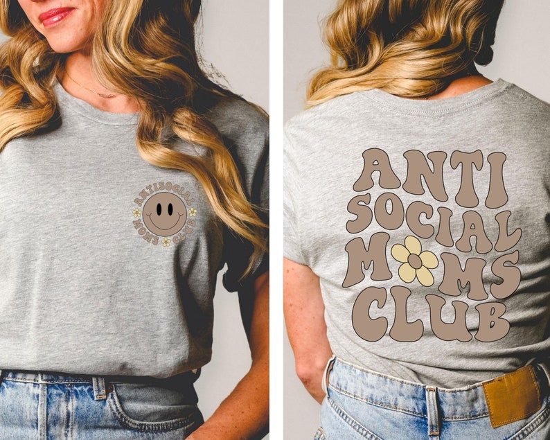 May include: A gray t-shirt with a brown smiley face with flowers around it on the front and the text "Anti Social Moms Club" in brown with a yellow flower on the back.