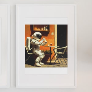 May include: An astronaut wearing a white spacesuit sits at a table outside a cafe, holding a glass of liquid. The cafe has an orange wall and a black door.