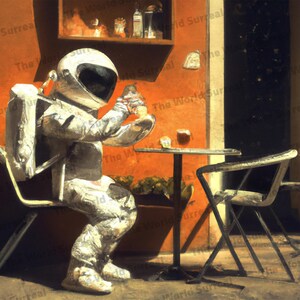 May include: A silver astronaut suit is sitting at a table in a cafe. The astronaut is holding a cup of coffee and looking at the camera. The cafe is painted in shades of orange and brown. The astronaut is wearing a white helmet with a black visor.
