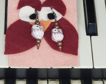 Wise Old Owl Earrings, carded on felt, with porcelain owl beads and copper tone findings.